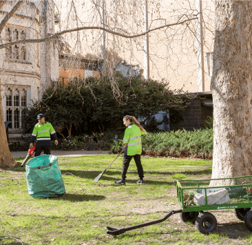 University grounds and maintenance team cleaning public spaces